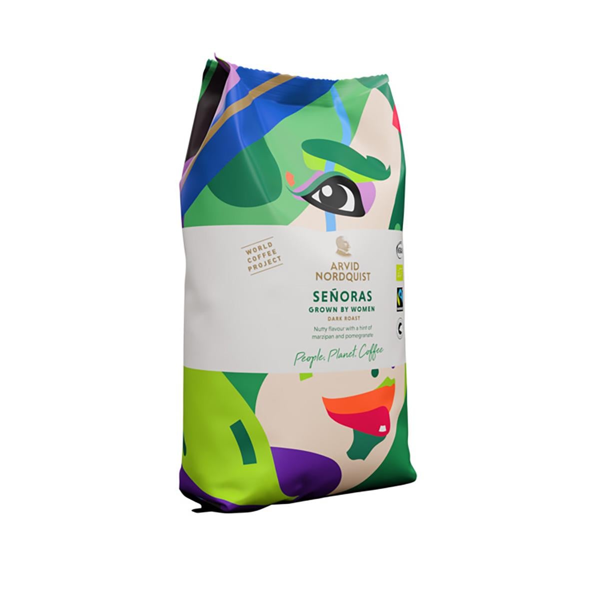 Kaffe från Arvid Nordquist med design av en kvinnlig ansiktsillustration i gröna, blå och röda nyanser