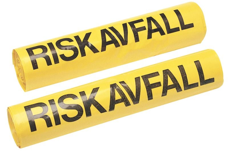 Två gula plastpåsar för riskavfall med svart text Riskavfall