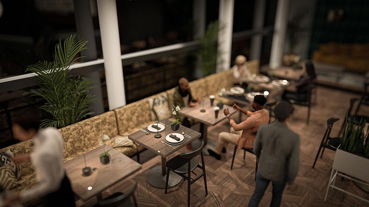 Människor som äter och pratar vid ett bord i en restaurang eller kafé på kvällen