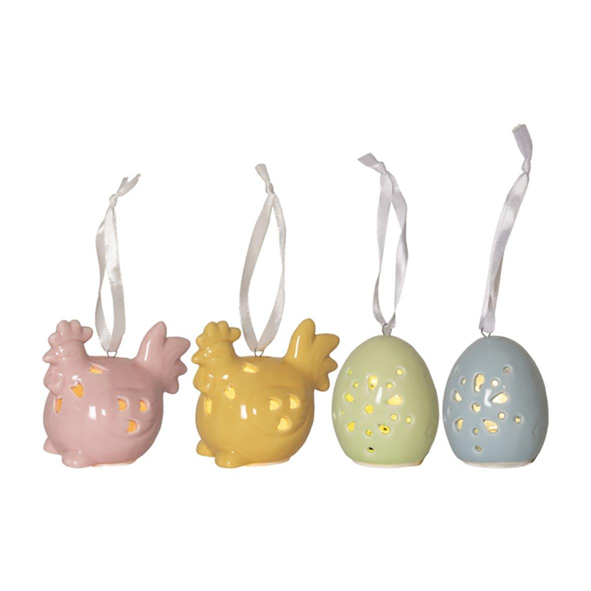 Fyrfadslyktor i form av kycklingar och ägg i pastellfärger