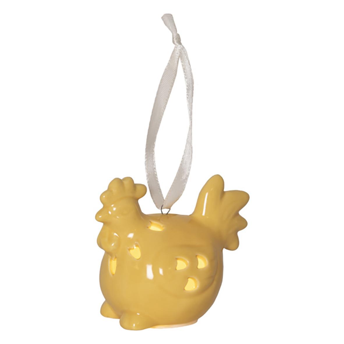 Gul dekorationsfigur i form av en kyckling med snöre för upphängning