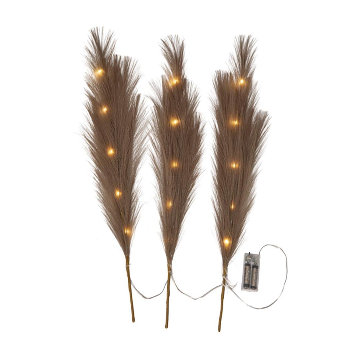 Tre bruna dekorationskvistar med inbyggda ljus och batteridrivare