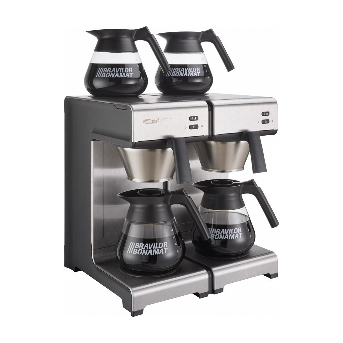 Kaffemaskin med fyra kannor, två på överdelen och två på underdelen, i rostfritt stål och svart plast