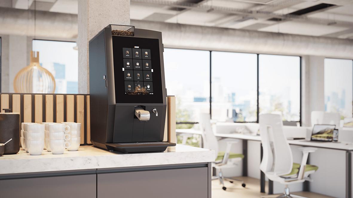 Kaffemaskin Bonamat Esprecious 12 på kontor med stora fönster och moderna möbler