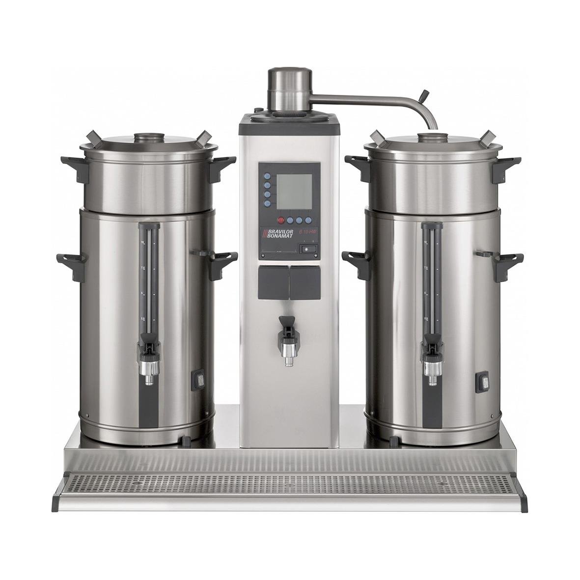 Industriell maskin med två stora cylindriska behållare och en kontrollpanel i mitten