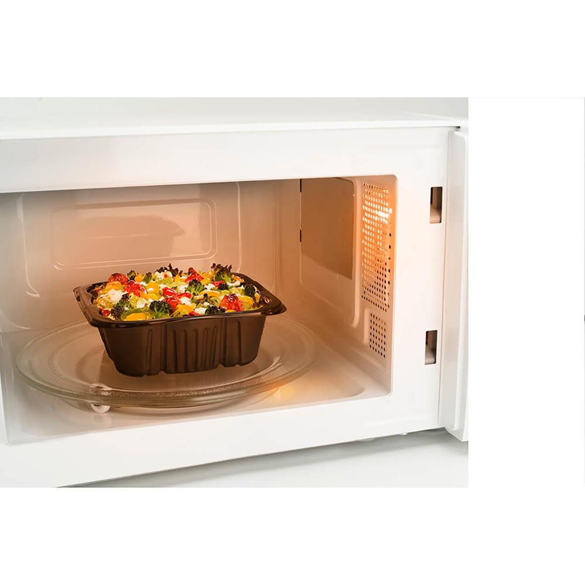 Mikrovågsugn Black+Decker med manuell vred, 700W, vit, 20L, visar mat i mikrovågsugnen