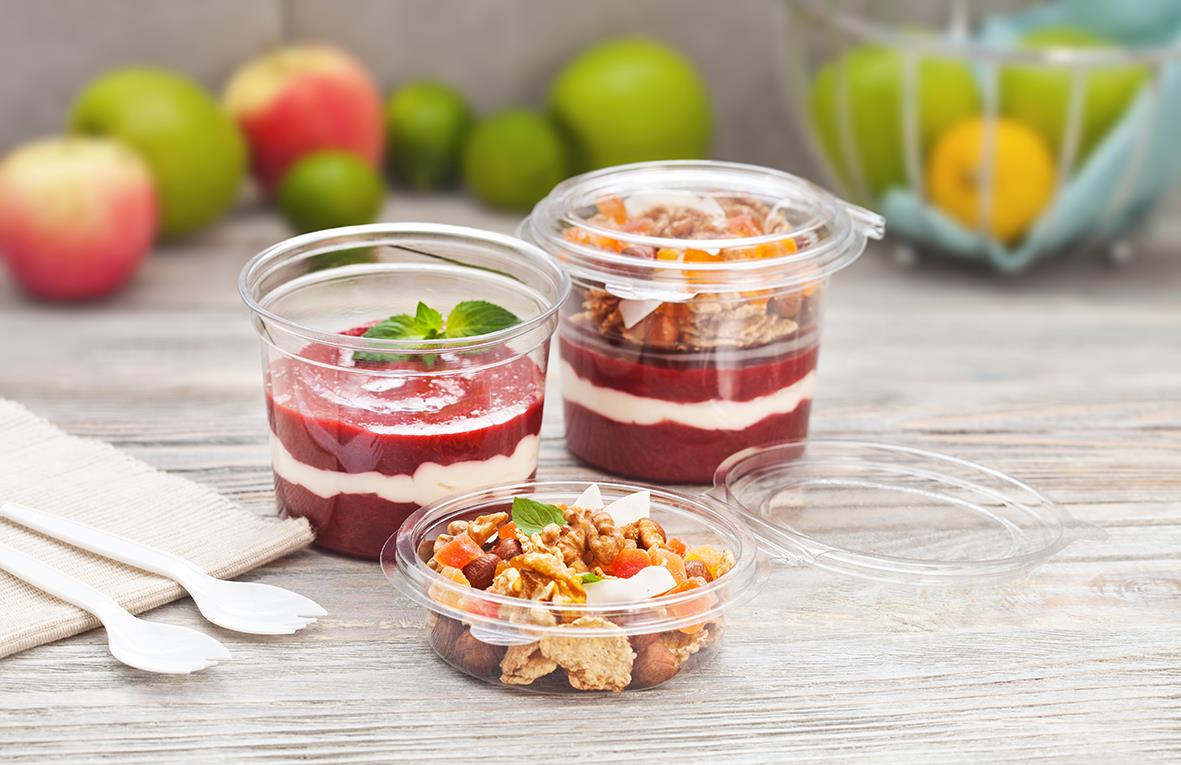 Klar plastformlock eller insats till plastbehållare med frukt- och dessertbilder