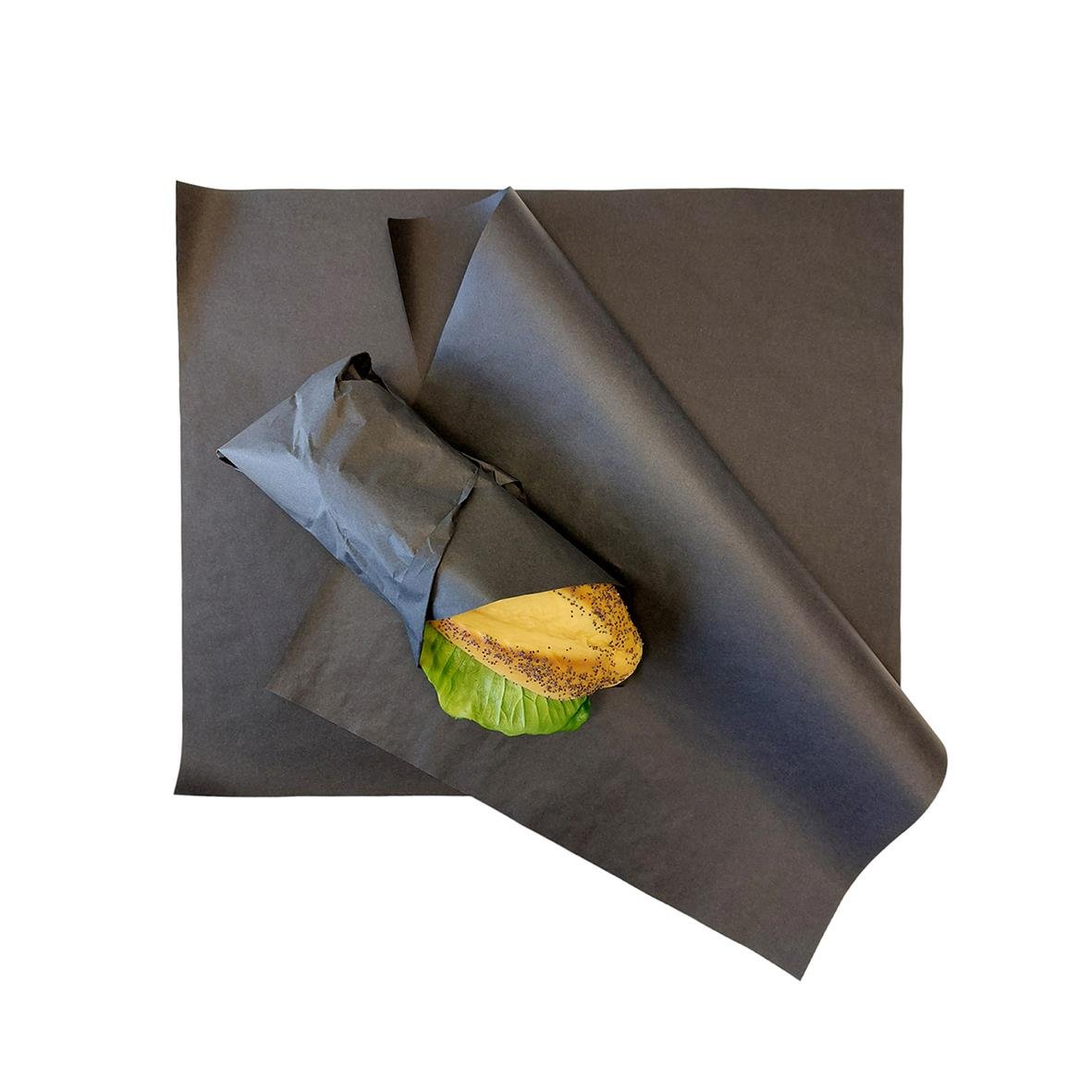 Svart vaxpapper för inpackning, 330x400mm, med ett bakverk inslaget