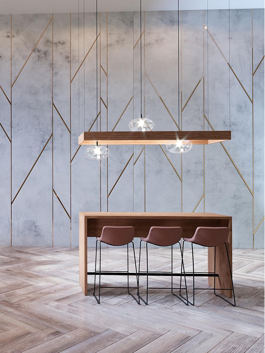 Bord i trä med tre stolar under, vägg med geometriska guldfärgade linjer, modern inredning