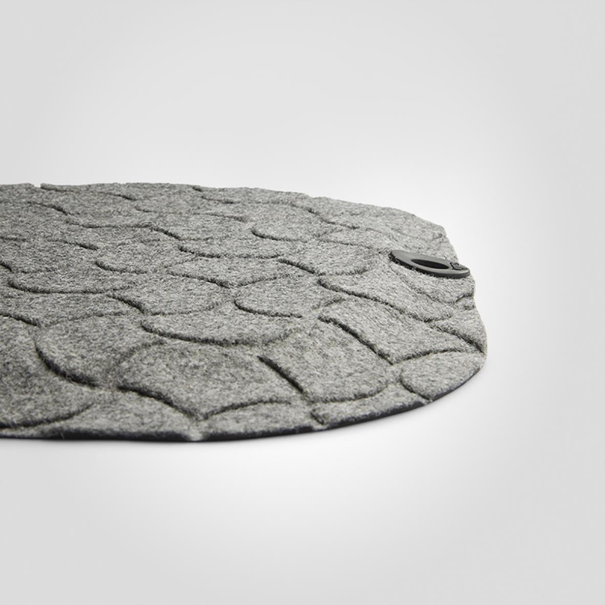 Stor grå arbetsplatsmatta med textur och rund form, 53x99cm