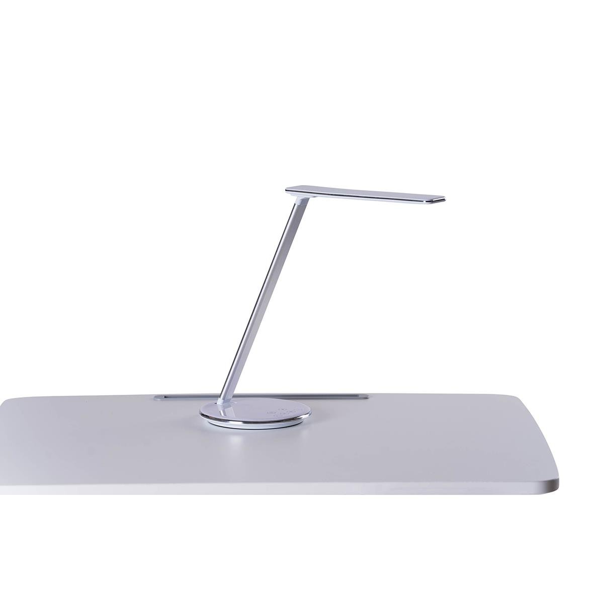 Vit bordslampa Sun-Flex Qlite på ett skrivbord