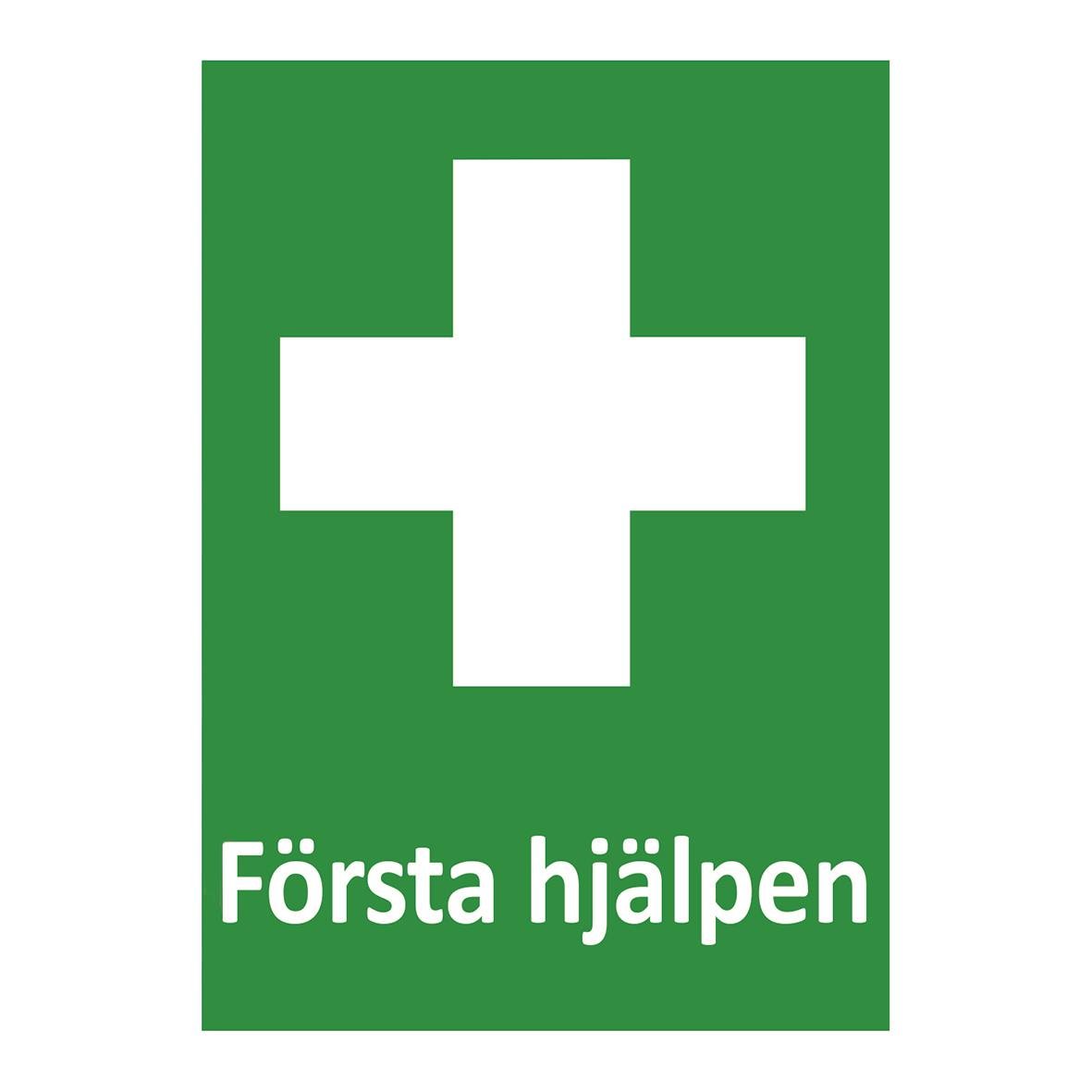 Grön skylt med vit kors och text Första hjälpen
