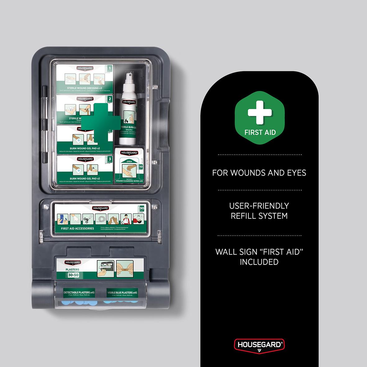 Första hjälpen station för brännskador med skylt, innehåller förbandsmaterial och instruktioner