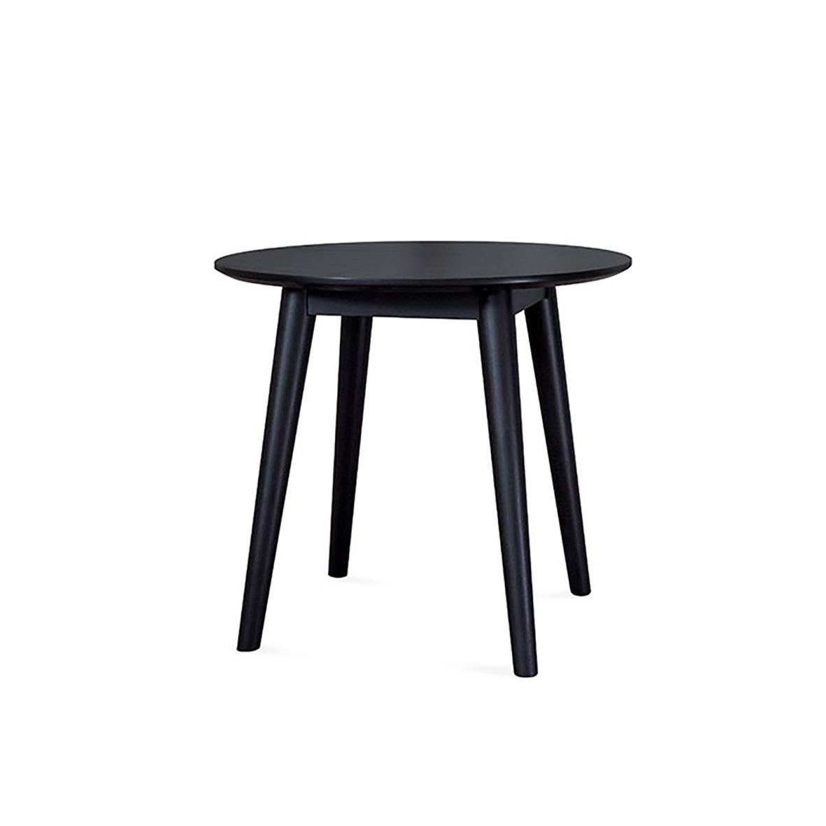 Svart rund bord med tre lutande ben på en vit bakgrund