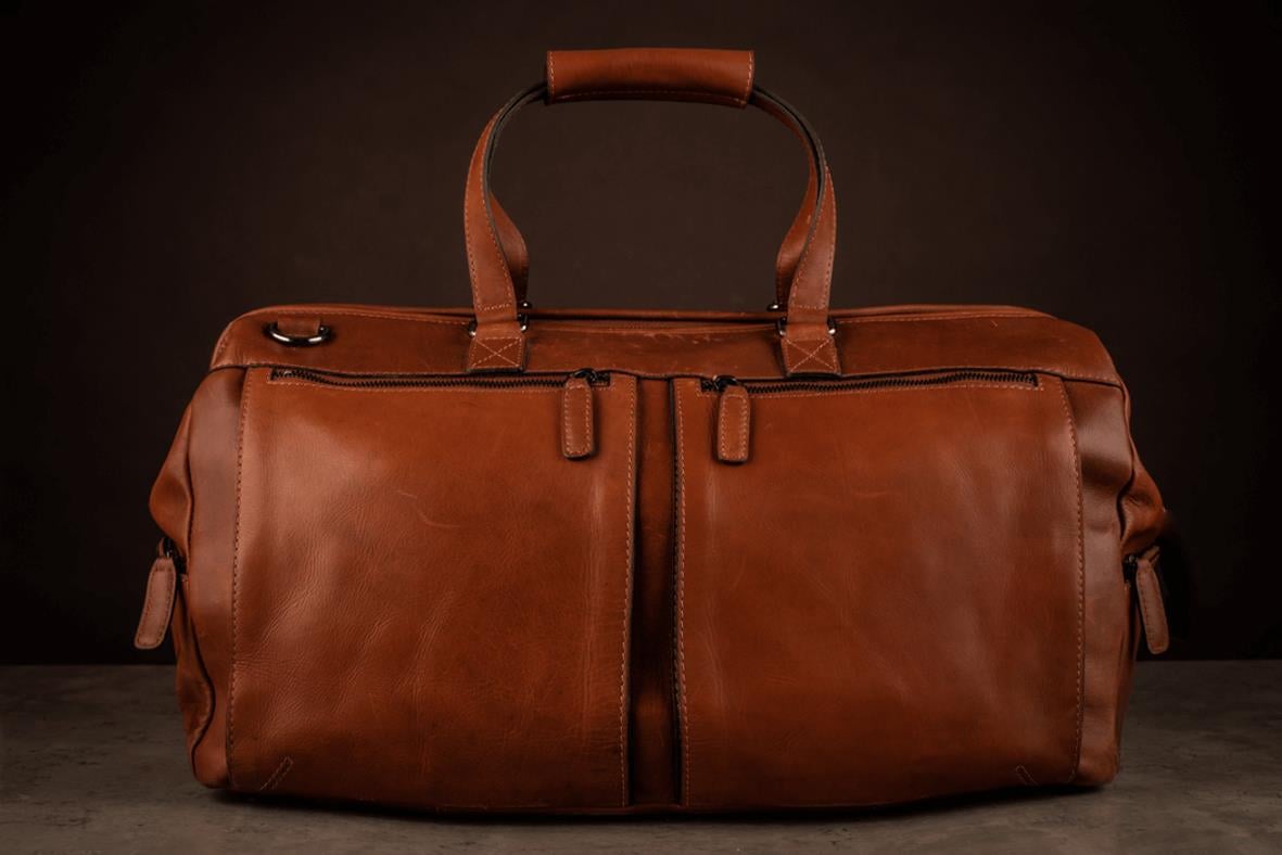 Weekendbag Portofino i skinn i färgen cognac med handtag och dragkedja