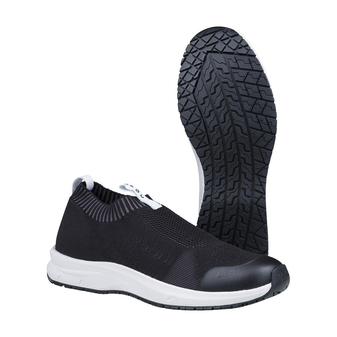 Svarta och vita arbetsskor med gummisula och snörning, designade för arbetsmiljö