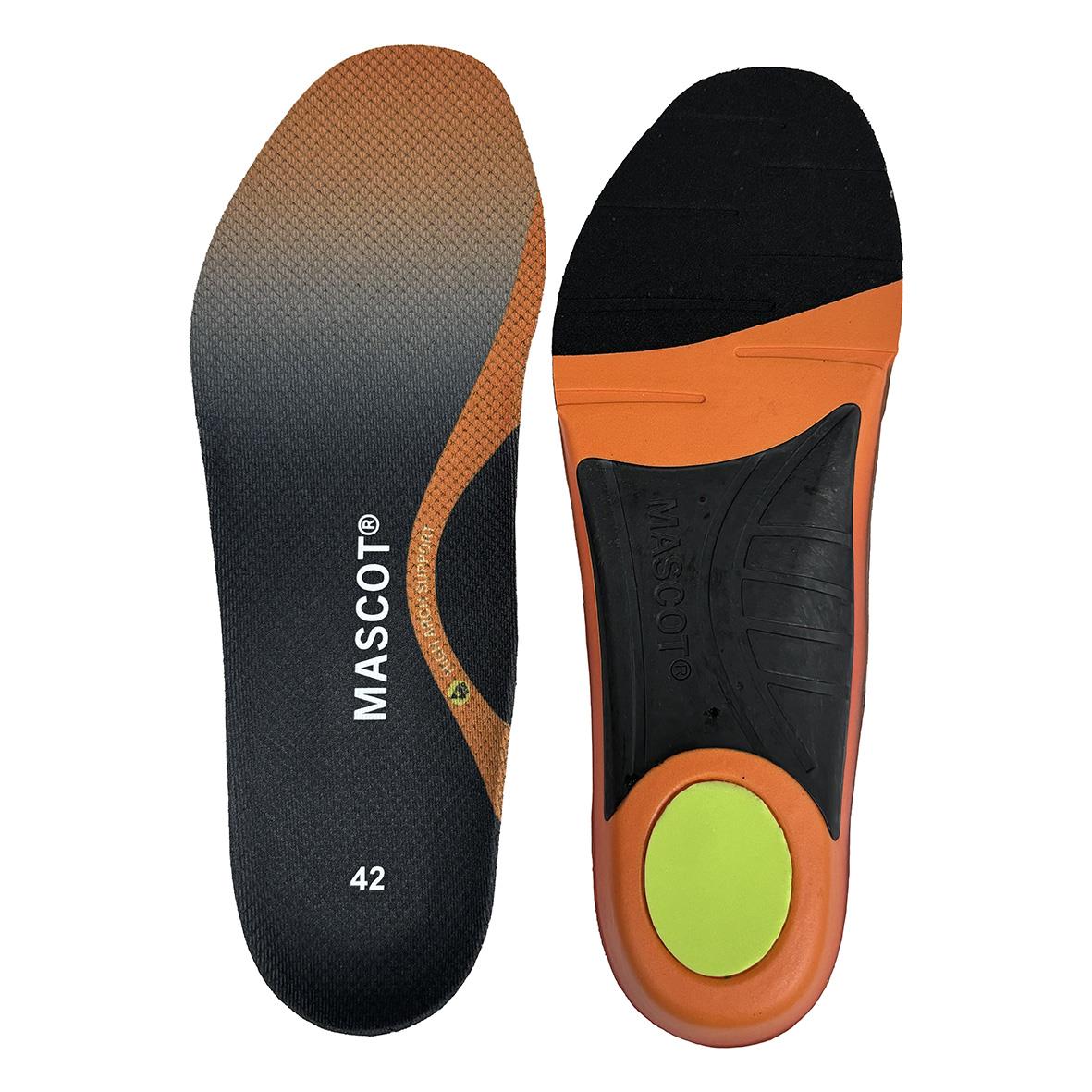 Sportskor inuti med orange och svart sula och en inläggssula med limegrön cirkel