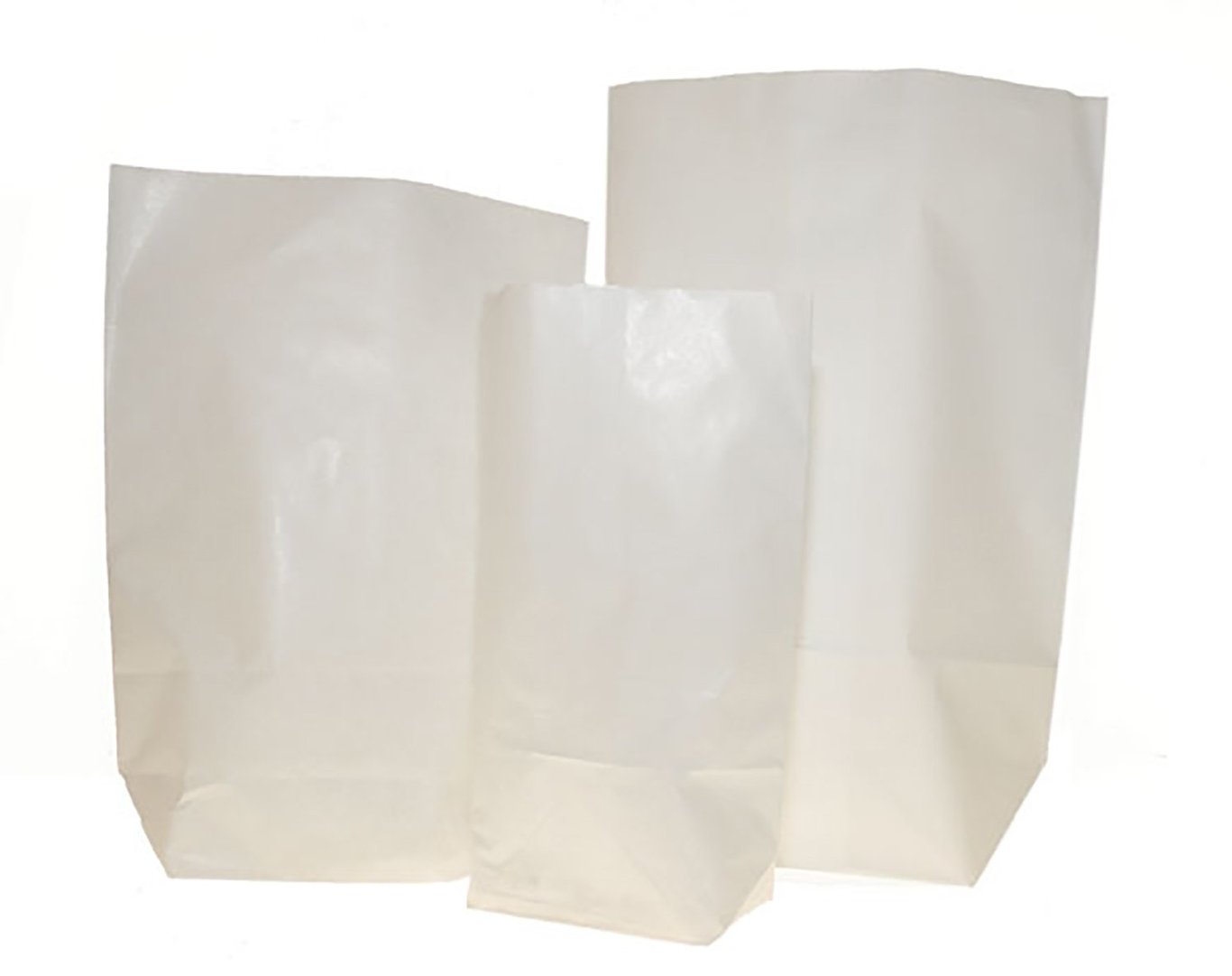 Tre vita papperspåsar av olika storlekar