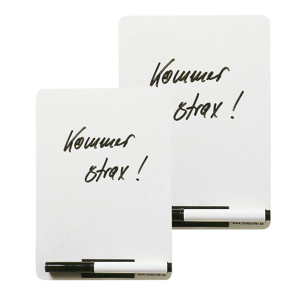 Vitwhiteboard med penna och sudd, texten Kommer snart! skriven på den