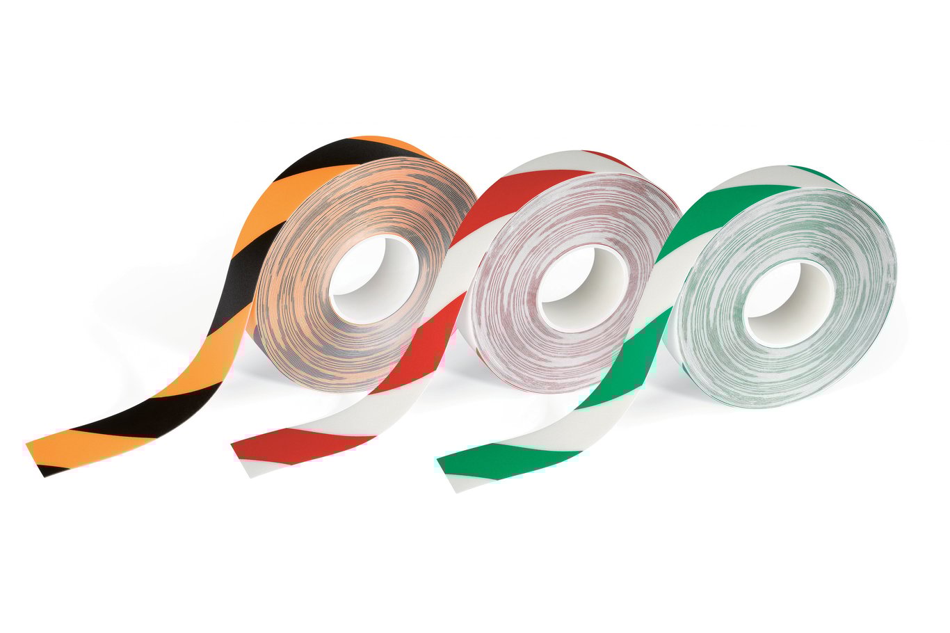 Tre rullar med varningsband i svart-orange, röd-vit och grön-vit färger