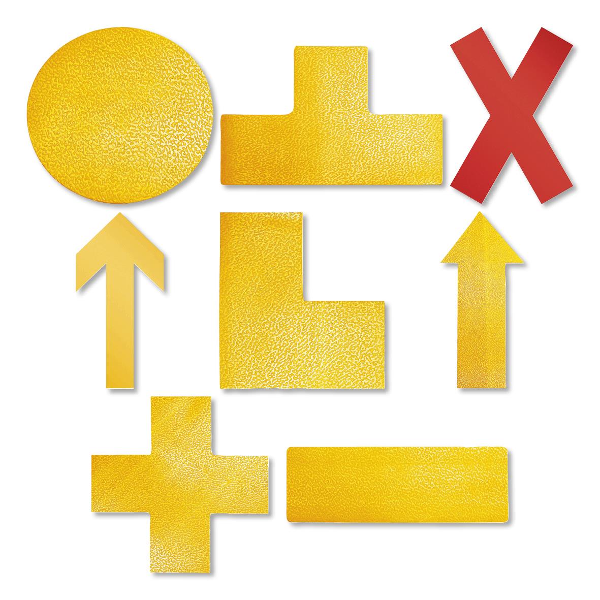 Guldfärgad golvmarkering i form av pilar och kors för tydlig vägledning