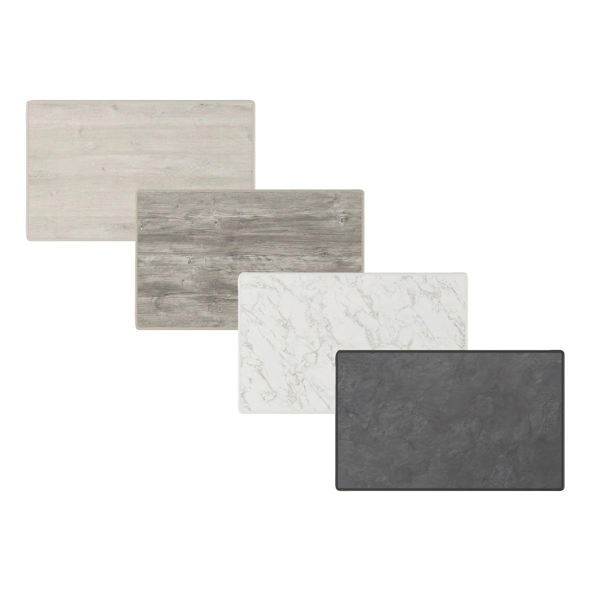 Fyra rektangulära bordsskivor i olika material och färger, inklusive trä, marmor och sten