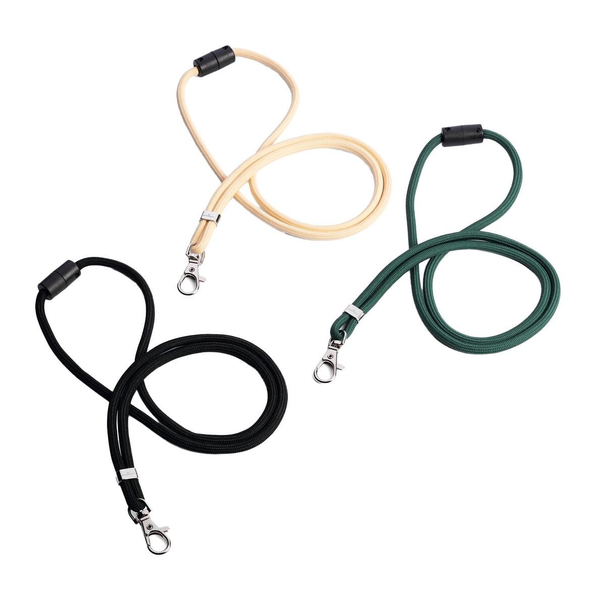 Tre nyckelband i svart, beige och grönt med hake och rundvävd design