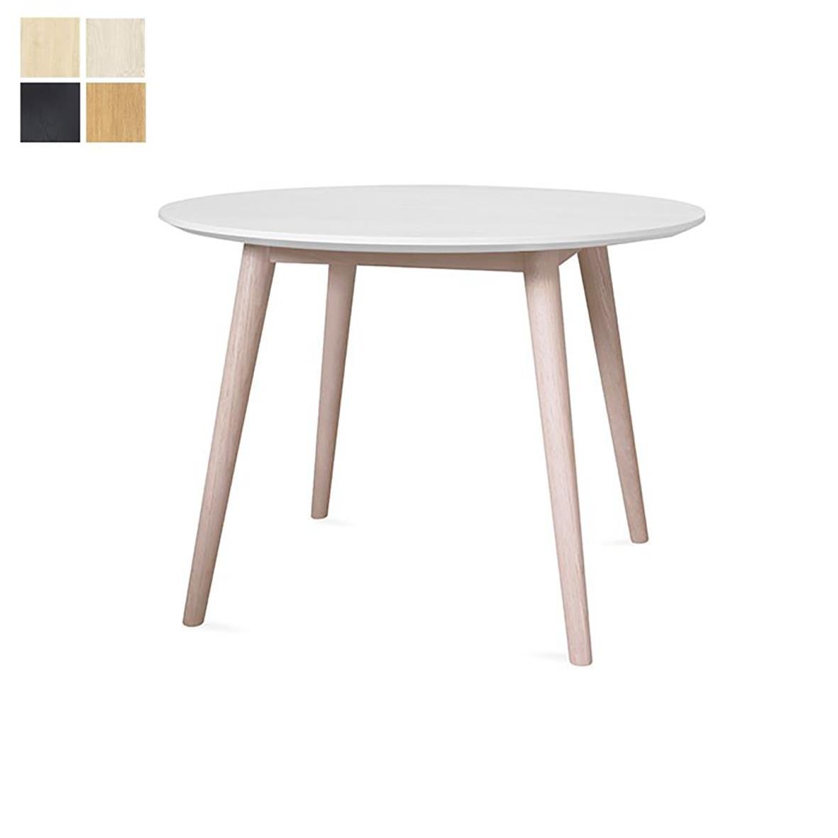 Runt vitt bord med fyra ljus träfärgade ben